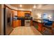 Modern condo kitchen, wood cabinets, granite counters at 211 E Flamingo Rd # 414, Las Vegas, NV 89169