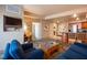 Living area with blue sofas and a view into the kitchen and dining area at 211 E Flamingo Rd # 414, Las Vegas, NV 89169