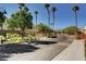 Community entrance with gated access and palm trees at 2495 April Breeze Ln, Henderson, NV 89002