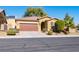 Single-story home with a two-car garage and landscaped front yard at 2804 Colts Ave, North Las Vegas, NV 89032