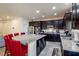 Modern kitchen with granite island and dark cabinets at 2804 Colts Ave, North Las Vegas, NV 89032