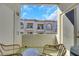 Relaxing balcony with patio furniture and views of the community at 3125 N Buffalo Dr # 2136, Las Vegas, NV 89128