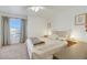 Spacious bedroom with a large bed and arched window at 3125 N Buffalo Dr # 2136, Las Vegas, NV 89128