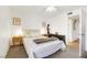 Well-lit bedroom with a full-size bed and ceiling fan at 3125 N Buffalo Dr # 2136, Las Vegas, NV 89128
