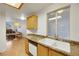 Kitchen with wood cabinets and stainless steel appliances at 3125 N Buffalo Dr # 2136, Las Vegas, NV 89128