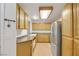 Well-equipped kitchen featuring wood cabinets at 3125 N Buffalo Dr # 2136, Las Vegas, NV 89128