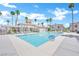 Relaxing community pool with a clubhouse and lounge chairs at 3125 N Buffalo Dr # 2136, Las Vegas, NV 89128