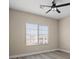 Simple bedroom with wood-look flooring and a large window at 315 Calgrove St, Las Vegas, NV 89138