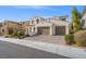 Two-story house with three-car garage and landscaped front yard at 315 Calgrove St, Las Vegas, NV 89138