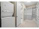 Laundry room with stackable washer and dryer and ample closet space at 315 Calgrove St, Las Vegas, NV 89138