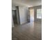 Bright living room with wood-look flooring and access to a private patio at 3450 Erva St # 167, Las Vegas, NV 89117