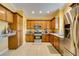 Modern kitchen with wood cabinets and granite counters at 3729 Blairmoor St, North Las Vegas, NV 89032