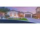 Stunning curb appeal with a two-car garage and landscaped yard at 4078 San Franchesca Ct, Las Vegas, NV 89141