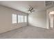 Well-lit bedroom with ceiling fan and neutral wall colors at 4635 Ridgeley Ave # 101, North Las Vegas, NV 89084