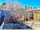 Small backyard with a patio table and chairs under a covered patio at 4713 Tamalpias Ave, Las Vegas, NV 89120