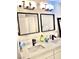 Bright bathroom featuring double sinks and large mirrors at 4713 Tamalpias Ave, Las Vegas, NV 89120