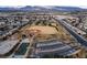 Aerial view showcasing a baseball field and parking lot in a residential area, surrounded by homes at 6701 Dorita Ave # 201, Las Vegas, NV 89108