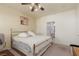 Cozy bedroom featuring a neutral color palette, a ceiling fan, and an en-suite bathroom for added convenience at 6701 Dorita Ave # 201, Las Vegas, NV 89108