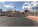 Gated community entrance with desert landscaping and well-maintained paved roads at 6701 Dorita Ave # 201, Las Vegas, NV 89108