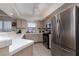 Modern kitchen featuring stainless steel appliances, including a refrigerator and gas range, and ample counter space at 6701 Dorita Ave # 201, Las Vegas, NV 89108