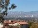 Stunning aerial view showcasing city skyline and mountain backdrop at 672 Los Feliz St, Las Vegas, NV 89110
