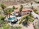 Aerial view showing a home with pool, putting green, and desert landscaping at 672 Los Feliz St, Las Vegas, NV 89110