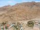 Aerial view of a house nestled in a mountainous desert landscape at 672 Los Feliz St, Las Vegas, NV 89110