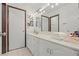 Clean bathroom with a double vanity, updated fixtures and plenty of counter space at 672 Los Feliz St, Las Vegas, NV 89110