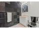 Small bathroom with soundproofed walls and black toilet at 672 Los Feliz St, Las Vegas, NV 89110