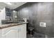 Bathroom with black toilet and dark slate tile at 672 Los Feliz St, Las Vegas, NV 89110