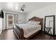 Primary bedroom with a king-size bed and access to a private patio at 672 Los Feliz St, Las Vegas, NV 89110