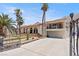 Luxury home with gated entrance and large driveway, desert setting at 672 Los Feliz St, Las Vegas, NV 89110