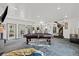 Spacious game room with pool table and access to kitchen at 672 Los Feliz St, Las Vegas, NV 89110