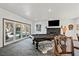 Game room with pool table, fireplace, and access to backyard at 672 Los Feliz St, Las Vegas, NV 89110