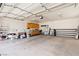 Spacious garage with workshop cabinets and shelving at 672 Los Feliz St, Las Vegas, NV 89110