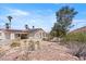 Spanish-style home with solar panels and desert landscaping at 672 Los Feliz St, Las Vegas, NV 89110