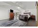 Main bedroom with high ceilings, dark wood floors and a sitting area at 672 Los Feliz St, Las Vegas, NV 89110