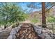 Stone pathway meanders through the landscape at 672 Los Feliz St, Las Vegas, NV 89110