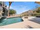 Relaxing pool with waterfall and lounge chairs at 672 Los Feliz St, Las Vegas, NV 89110