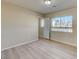 Spacious bedroom with window and door to hallway at 6737 Boccelli Ct, Las Vegas, NV 89139