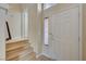 Bright entryway with tiled floor and view of the stairs and front door at 6737 Boccelli Ct, Las Vegas, NV 89139