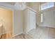 Bright entryway with tile flooring, powder room, and staircase at 6737 Boccelli Ct, Las Vegas, NV 89139