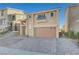 Two story house with attached garage and paved driveway at 6737 Boccelli Ct, Las Vegas, NV 89139