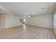 Large living room with light laminate flooring and ceiling fan at 6737 Boccelli Ct, Las Vegas, NV 89139