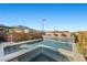 Modern pool and spa with waterfall feature and mountain views at 6833 Desert Crimson St, Las Vegas, NV 89148