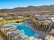 Relaxing community pool with surrounding lounge area at 6833 Desert Crimson St, Las Vegas, NV 89148