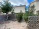 Landscaped backyard with flagstone patio and wooden fence at 7555 Glowing Ember Ct # 201, Las Vegas, NV 89130