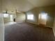 Spacious living room with neutral carpeting and high ceilings at 7555 Glowing Ember Ct # 201, Las Vegas, NV 89130