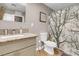 Bathroom with granite vanity, shower, and tree-themed decor at 821 Mar Jay Ct, Las Vegas, NV 89107