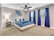 King bedroom with blue and white bedding and ceiling fan at 821 Mar Jay Ct, Las Vegas, NV 89107